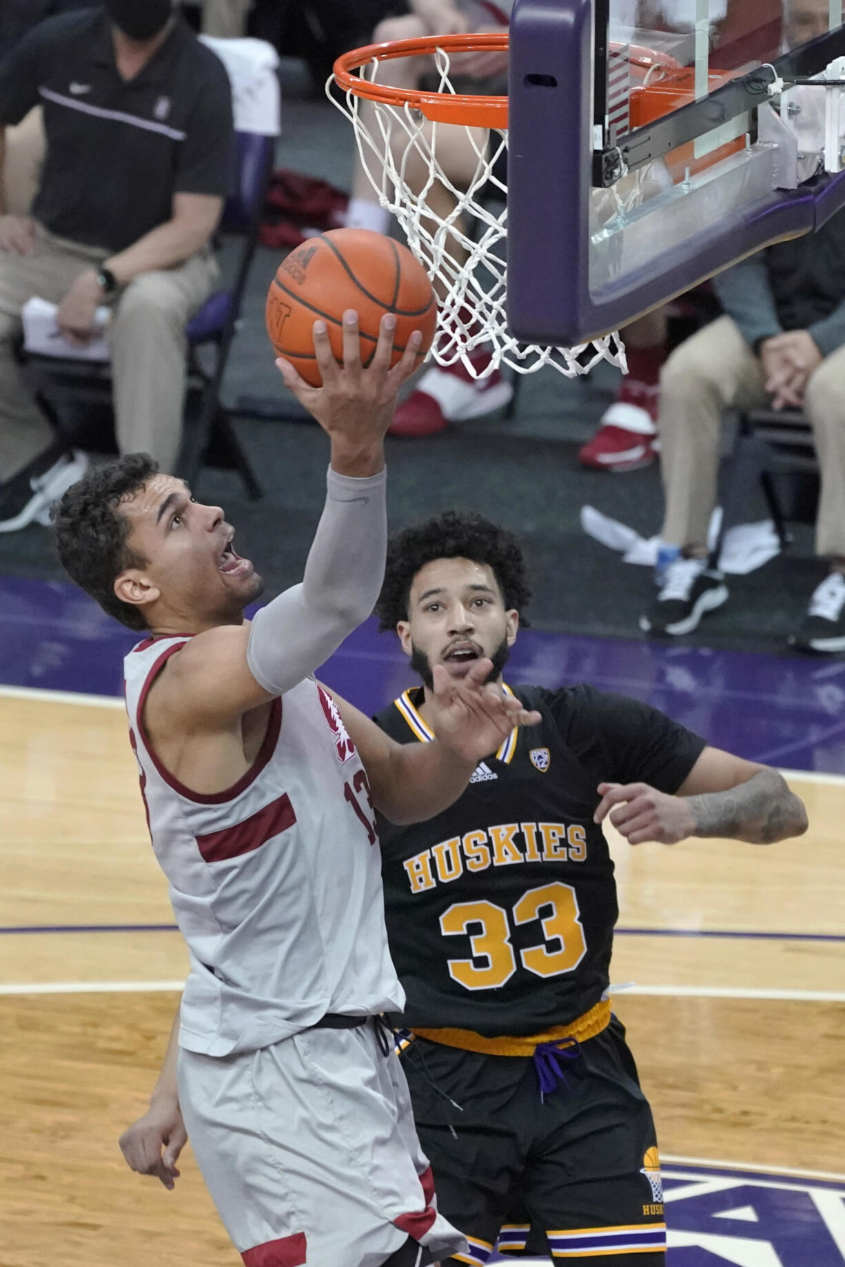 Stanford forward Oscar da Silva, left, shoots against Washington forward J'Raan Brooks (33) during the second half of an NCAA college basketball game Thursday, Feb. 18, 2021, in Seattle. (AP Photo/Ted S.