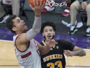 Stanford forward Oscar da Silva, left, shoots against Washington forward J'Raan Brooks (33) during the second half of an NCAA college basketball game Thursday, Feb. 18, 2021, in Seattle. (AP Photo/Ted S.