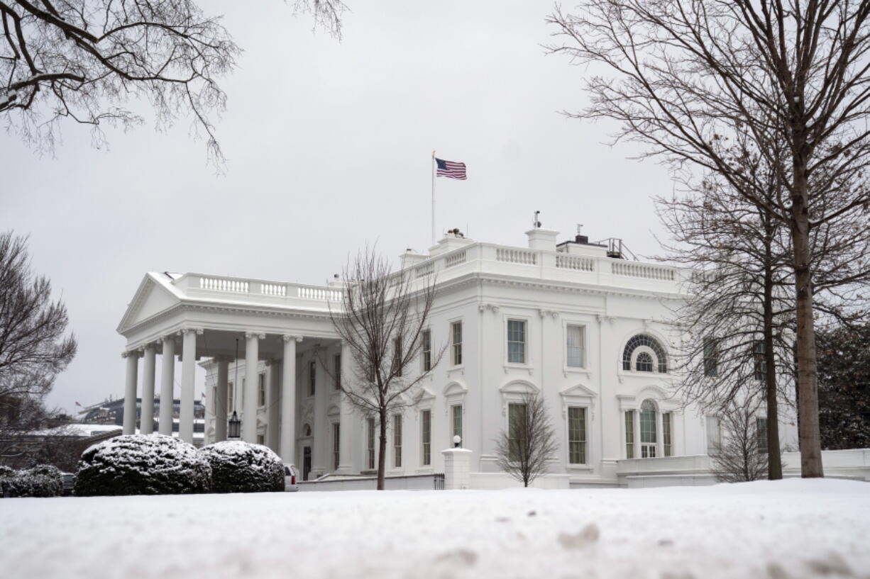 In this Feb. 1, 2021, photo, snow covers the ground at the White House in Washington. Only a fragment of Americans believe democracy is thriving in the U.S., even as broad majorities agree that representative government is one of the country&#039;s bedrock principles, according to a new poll from The Associated Press-NORC Center for Public Affairs Research. Just 16% of Americans say democracy is working well or extremely well, a pessimism that spans the political spectrum.