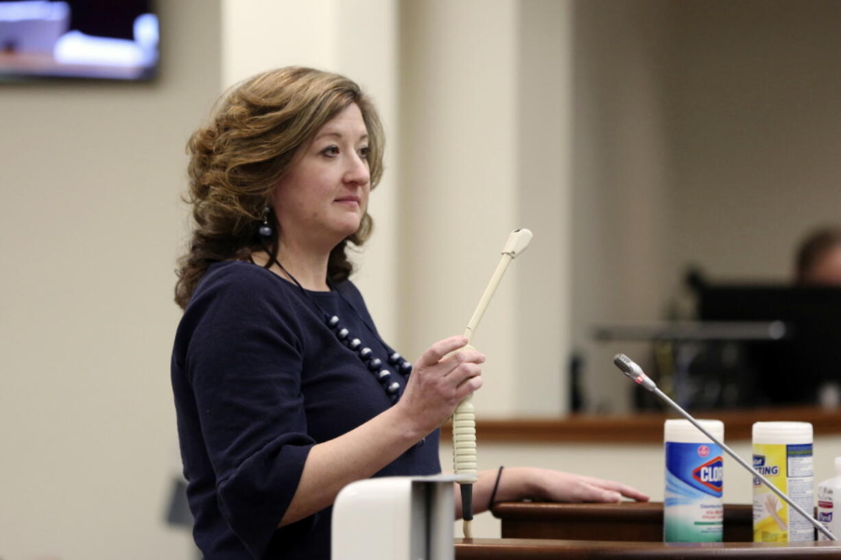 Melissa Anne &quot;Mac&quot; Cunningham-Sereque shows the wand used to do ultrasound on pregnant women during a South Carolina House subcommittee hearing on an abortion bill on Wednesday, Feb. 3, 2021, in Columbia, S.C. The bill would outlaw almost all abortions in the state.