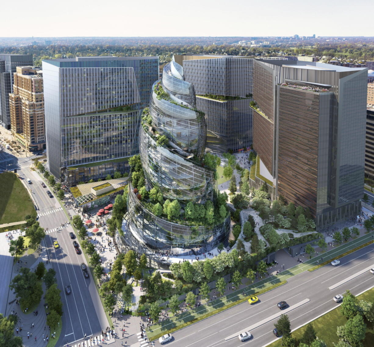 This artist rendering provided by Amazon shows the next phase of the company&#039;s headquarters redevelopment to be built in Arlington, Va. The plans released Tuesday, Feb. 2, 2021, features a 350-foot helix-shaped office tower that can be climbed from the outside like a mountain hike.