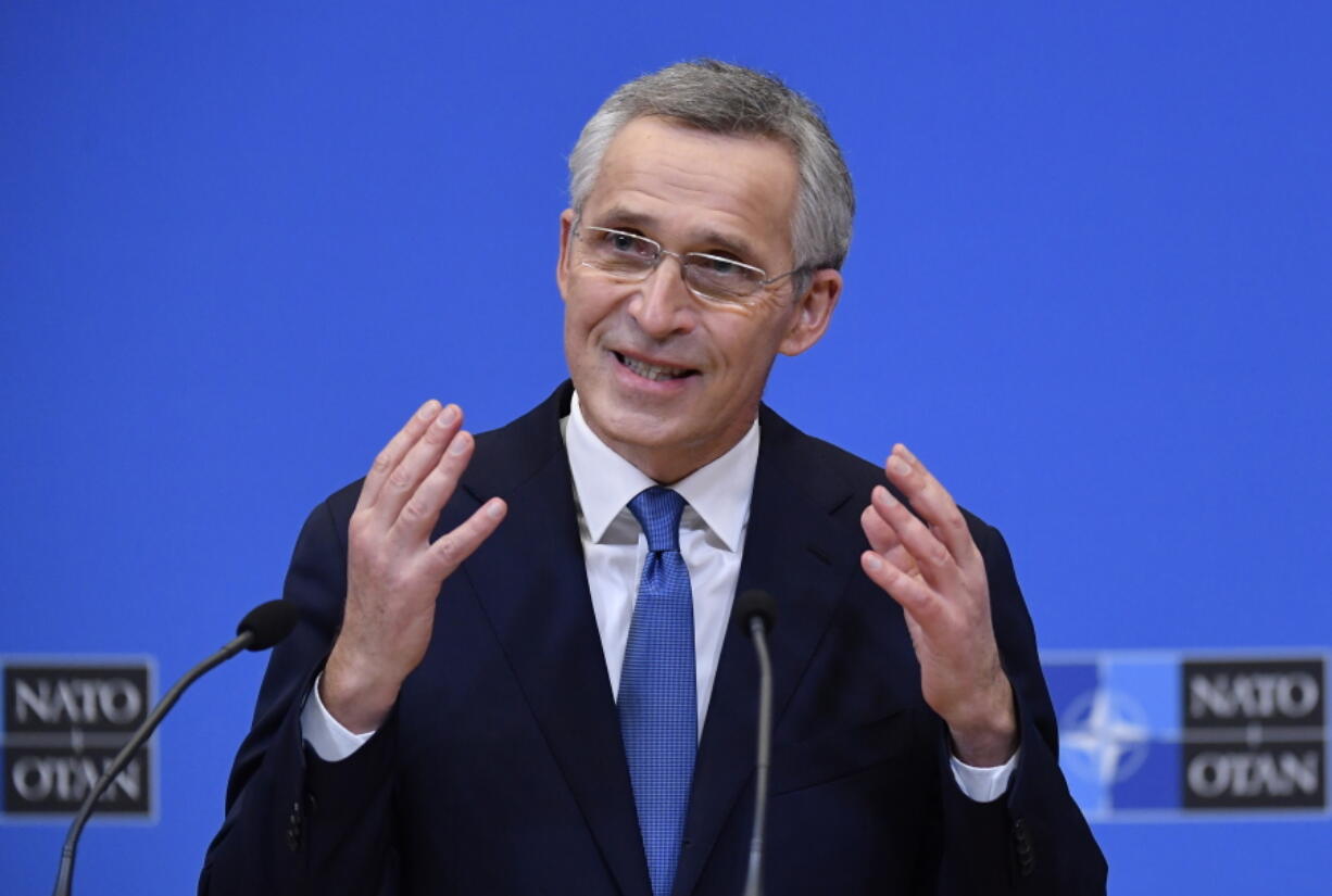 NATO Secretary General Jens Stoltenberg gestures as he addresses a media conference following a virtual meeting of NATO defense ministers at NATO headquarters in Brussels, Wednesday, Feb. 17, 2021.