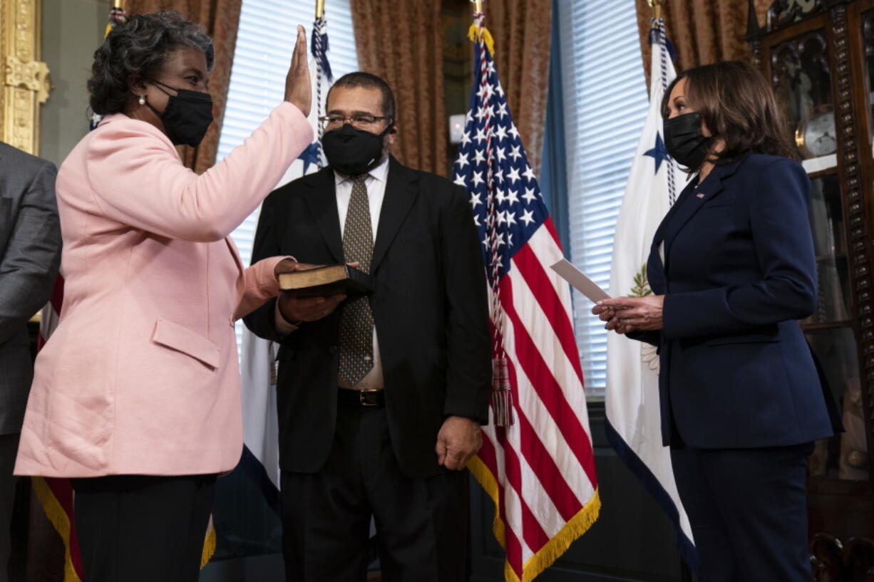 Vice President Kamala Harris hosts a ceremonial swearing in for U.S. Ambassador to the United Nations Linda Thomas-Greenfield, at the Eisenhower Executive Office building on the White House campus, Wednesday, Feb. 24, 2021, in Washington. From left, Thomas-Greenfield, her husband Lafayette Greenfield, and Harris.