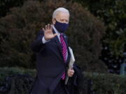 President Joe Biden waves as he walks to board Marine One on the South Lawn of the White House, Friday, Feb. 5, 2021, in Washington. (AP Photo/Alex Brandon) (Nam Y.