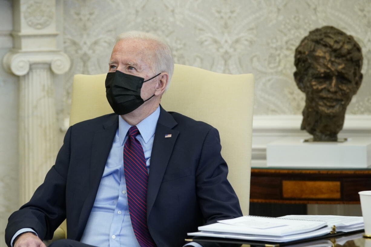 President Joe Biden speaks with House Democratic Leaders in the Oval Office of the White House, Friday, Feb. 5, 2021, in Washington.