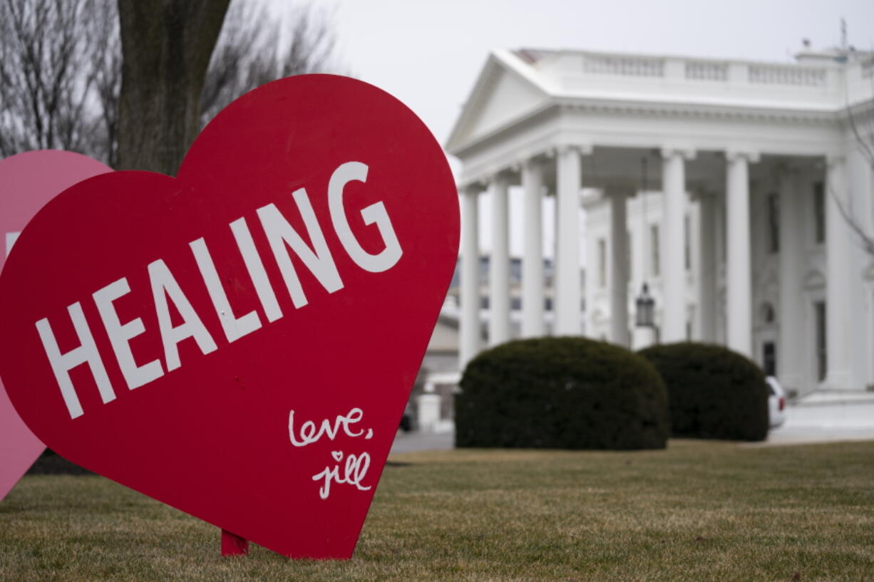 A Valentine&#039;s Day decoration, signed by first lady Jill Biden, sits on the North Lawn of the White House, Friday, Feb. 12, 2021, in Washington.