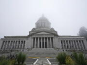 The Legislative Building is shown partially shrouded in fog at the Capitol in Olympia. (AP Photo/Ted S.