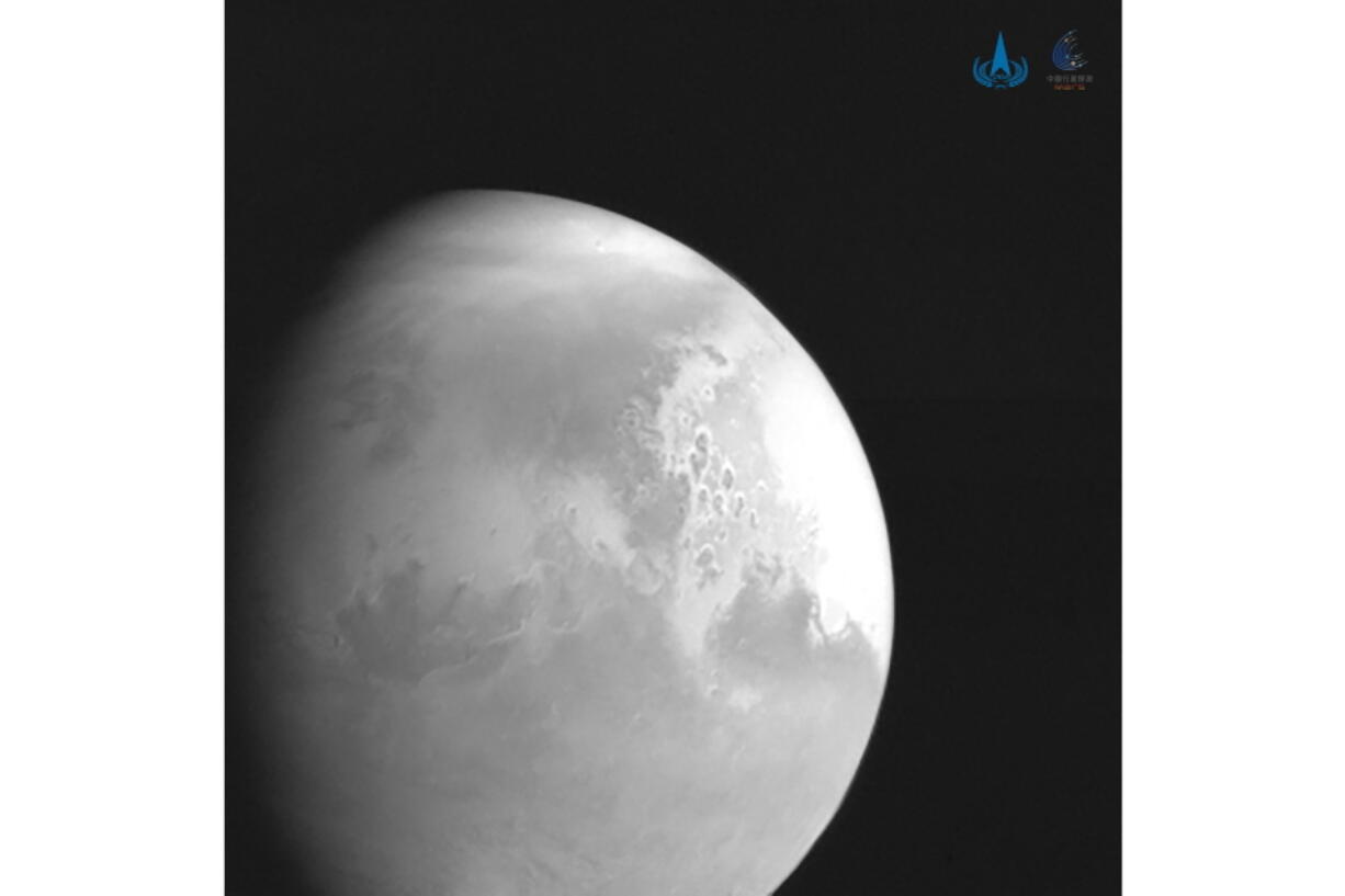 In this undated photo released by the China National Space Administration, a view of the planet Mars is captured by China&#039;s Tianwen-1 Mars probe from a distance of 2.2 million kilometers (1.37 million miles). A Chinese spacecraft appears poised to enter orbit around Mars on Wednesday, Feb. 10, 2021, one day after an orbiter from the United Arab Emirates did so, and about a week ahead of an American attempt to put down another spacecraft on the surface of the red planet.