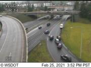 Vancouver police investigate an apparently stolen delivery truck on the onramp to Interstate 5 on Thursday afternoon.