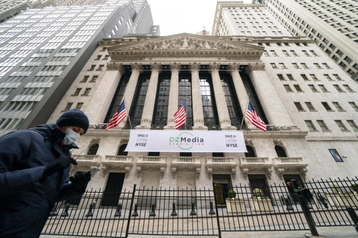 Pedestrians pass the New York Stock Exchange, Wednesday, Jan. 27, 2021, in New York. Major stock indexes are opening modestly higher on Wall Street as investors turn their focus to some strong earnings reports from Big Tech companies and hopes for getting more economic stimulus passed in Washington. The S&amp;P 500 was up 0.3% in the early going on Wednesday, Feb. 3.