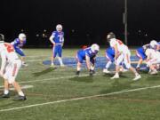 Ridgefield quarterback Luke Price (2) surveys the field before a play in Friday's 48-0 win over Washougal at Ridgefield High (Micah Rice/The Columbian)