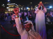 Emiratis celebrate after the Hope Probe enters Mars orbit as a part of Emirates Mars mission, in Dubai, United Arab Emirates, Tuesday, Feb. 9, 2021. The spacecraft from the United Arab Emirates swung into orbit around Mars in a triumph for the Arab world&#039;s first interplanetary mission. It is the first of three robotic explorers arriving at the red planet over the next week and a half.