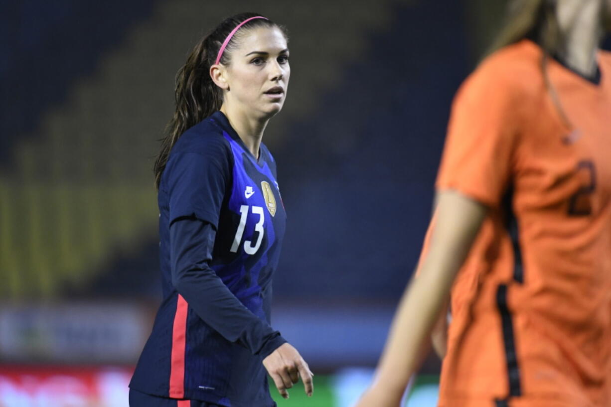 FILE - In this Nov. 27, 2020, file photo, United States Alex Morgan reacts during the international friendly women&#039;s soccer match agaiinst The Netherlands at Rat Verlegh stadium in Breda, southern Netherlands. Morgan is back with the U.S. national team and learning to adjust to a career as a working mom.