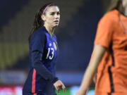 FILE - In this Nov. 27, 2020, file photo, United States Alex Morgan reacts during the international friendly women&#039;s soccer match agaiinst The Netherlands at Rat Verlegh stadium in Breda, southern Netherlands. Morgan is back with the U.S. national team and learning to adjust to a career as a working mom.