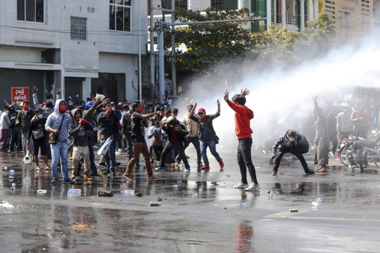 Police use water cannon to disperse demonstrators during a protest in Mandalay, Myanmar, Tuesday, Feb. 9, 2021. Police were cracking down on the demonstrators against Myanmar&#039;s military takeover who took to the streets in defiance of new protest bans.