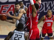 Oregon guard Chris Duarte (5) tries to pass the ball against Arizona during an NCAA college basketball game, Saturday, Feb. 13, 2021, in Tucson, Ariz.