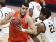 Oregon State center Roman Silva drives to the basket against California forward Andre Kelly during the first half of an NCAA college basketball game in Berkeley, Calif., Thursday, Feb. 25, 2021.