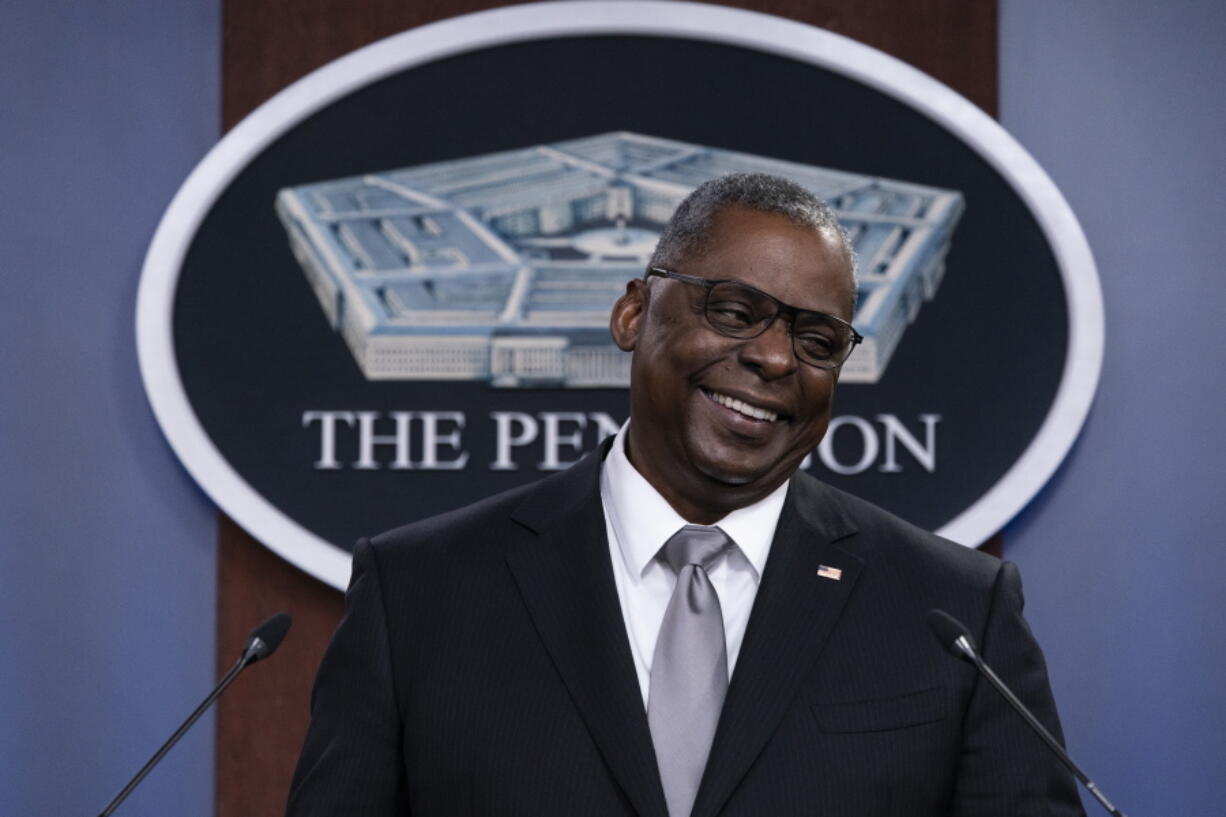Secretary of Defense Lloyd Austin smiles as he speaks during a media briefing at the Pentagon, Friday, Feb. 19, 2021, in Washington.