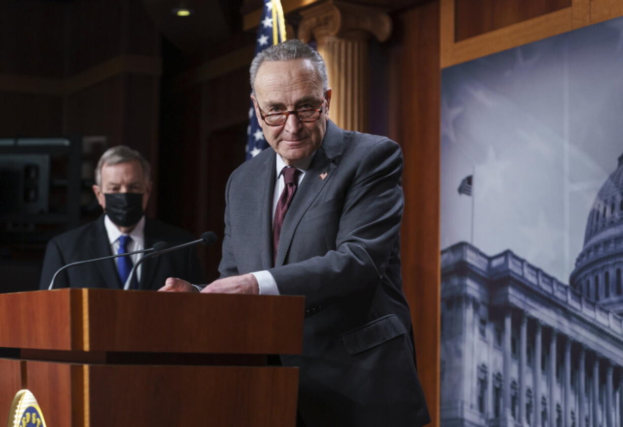 Senate Majority Leader Chuck Schumer, D-N.Y., joined at left by Sen. Dick Durbin, D-Ill., the majority whip, speaks at a news conference at the Capitol in Washington, Tuesday, Feb. 2, 2021. (AP Photo/J.