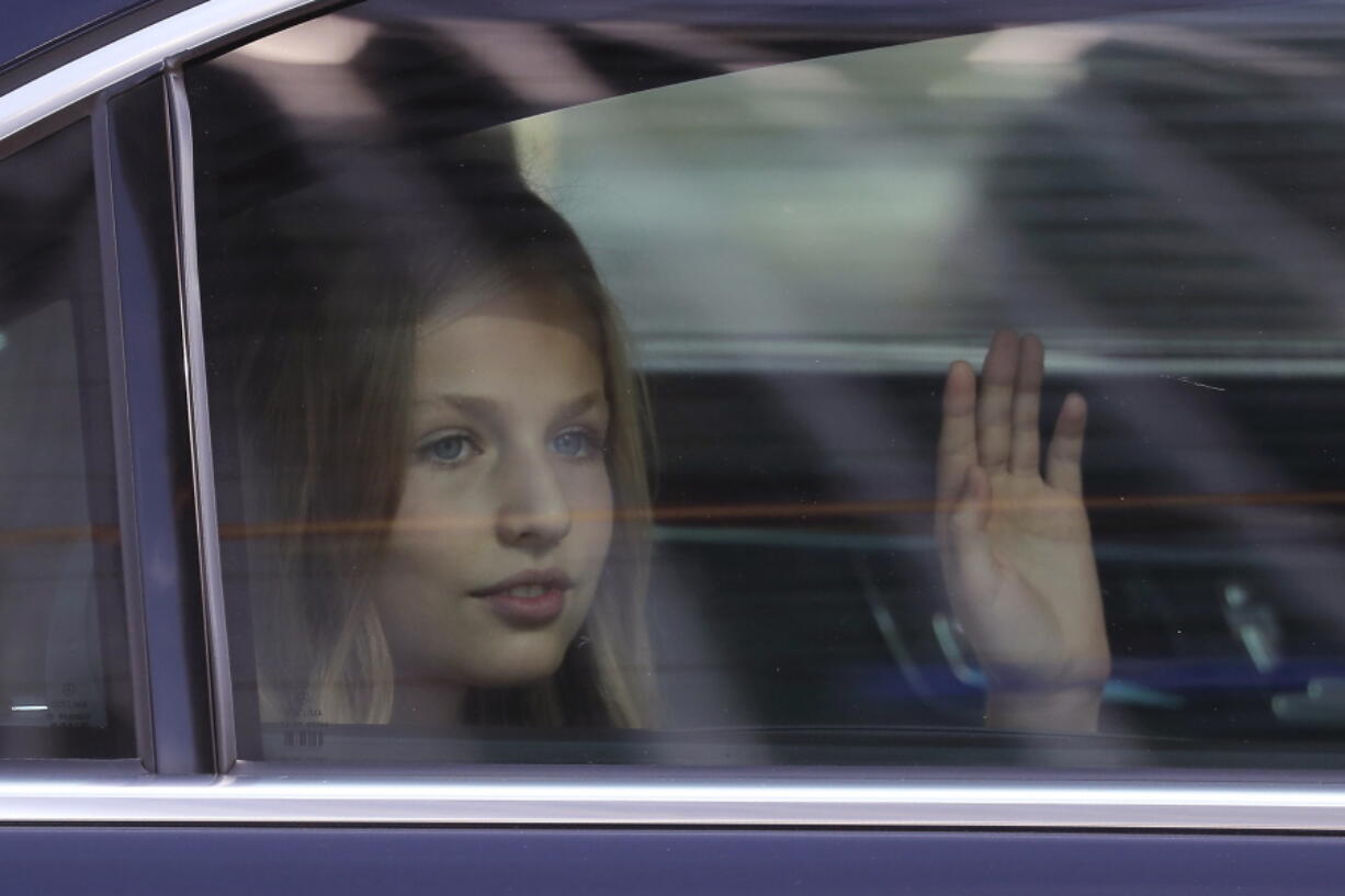 FILE - In this file photo dated Saturday, Oct. 12, 2019, Princess Leonor of Spain waves to the crowd after a military parade as they celebrate a holiday known as &#039;Dia de la Hispanidad&#039; or Spain&#039;s Hispanic Day in Madrid, Spain. Heir to the Spanish throne, 15-year-old Princess Leonor will study a two-year course at UWC Atlantic College, in southern Wales, the Spanish royal household announced Wednesday Feb.