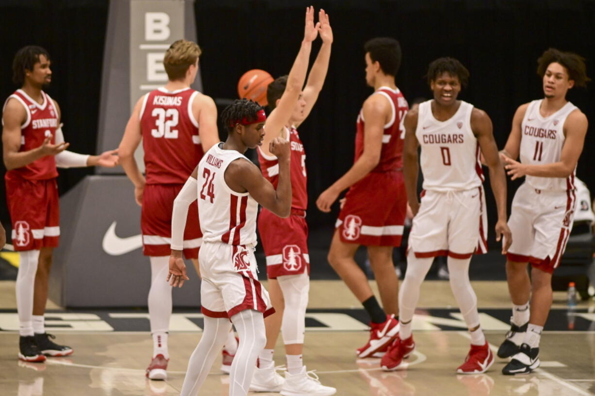 Washington State guard Noah Williams (24) reacts after scoring a basket while being fouled by Stanford guard Michael O&#039;Connell (5) during the first half of an NCAA college basketball game, Saturday, Feb. 20, 2021, in Pullman, Wash.