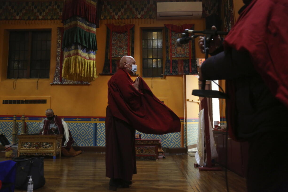 Lama Ngawang Yonten and other Buddhist members of the United Sherpa Association prepare for the Dakini Day practice, a group meditation that includes song and food and is celebrated on the 25th day of each lunar month, at their community temple in the Queens borough of New York on Friday, Jan. 8, 2021.