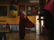 Lama Ngawang Yonten and other Buddhist members of the United Sherpa Association prepare for the Dakini Day practice, a group meditation that includes song and food and is celebrated on the 25th day of each lunar month, at their community temple in the Queens borough of New York on Friday, Jan. 8, 2021.