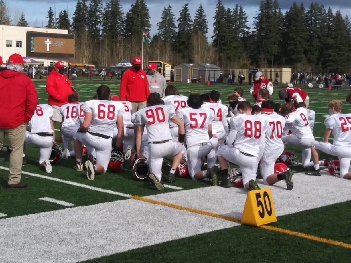 Coach Aaron Gehring talks to his players after Castle Rock's win over Goldendale on Saturday, Feb.