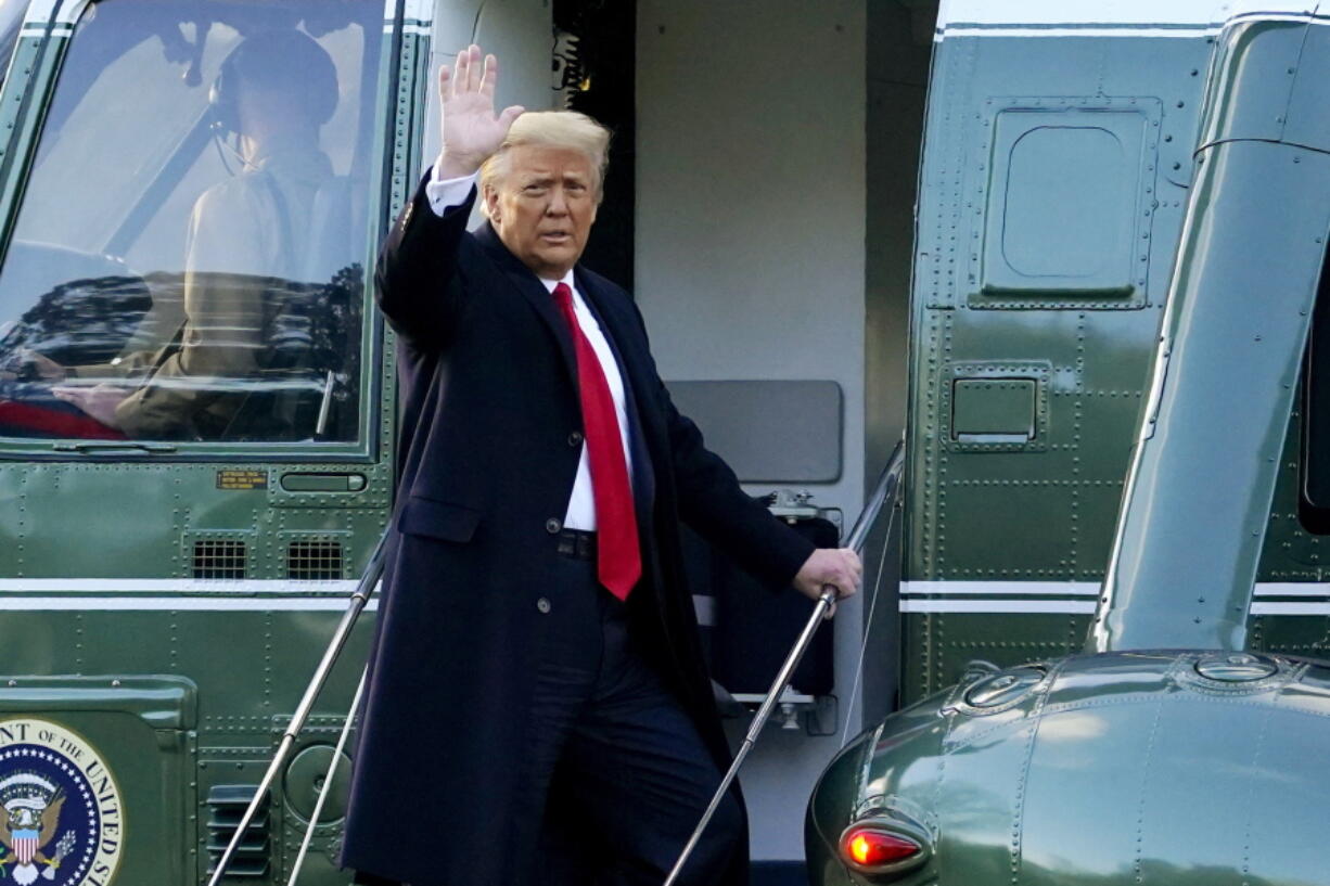 FILE - In this Wednesday, Jan. 20, 2021, file photo, President Donald Trump waves as he boards Marine One on the South Lawn of the White House, in Washington, en route to his Mar-a-Lago Florida Resort. Former President Trump has named two lawyers to his impeachment defense team, one day after it was revealed that the former president had parted ways with an earlier set of attorneys.