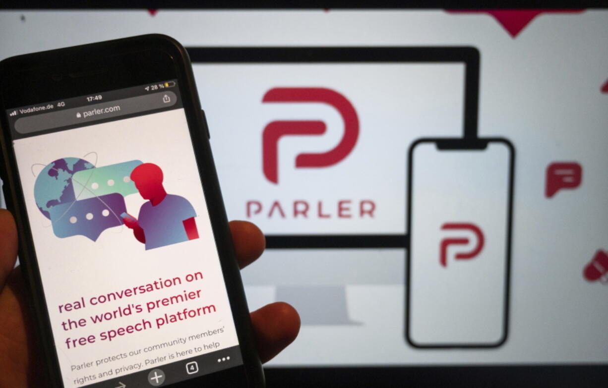 FILE - In this Jan. 10, 2021, file photo, the website of the social media platform Parler is displayed in Berlin. John Matze said Wednesday, Feb. 3, 2021 he has been fired as CEO of Parler, which was among social media services used to plan the Jan. 6 attack on the U.S. Capitol by supporters of then-President Donald Trump.