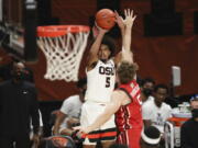 Oregon State&#039;s Ethan Thompson (5) shoots over Utah&#039;s Jaxon Brenchley (5) during the second half of an NCAA college basketball game in Corvallis, Ore., Thursday, Feb. 18, 2021.