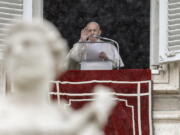 Pope Francis delivers his blessing from his studio window overlooking St. Peter&#039;s Square, at the Vatican, Sunday, Feb. 7, 2021.