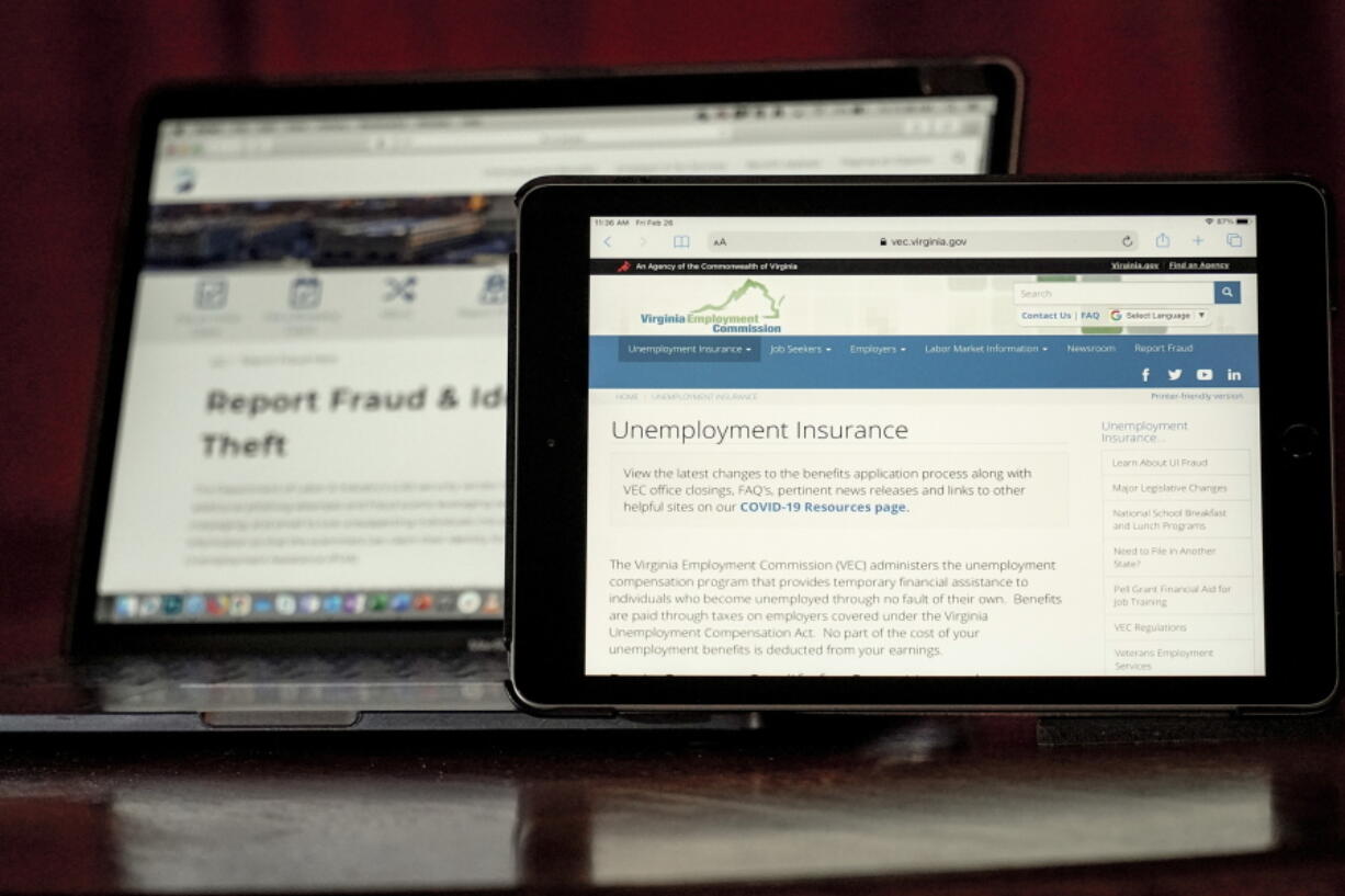 Web pages used to show information for collecting unemployment insurance in Virginia, right, and reporting fraud and identity theft in Pennsylvania, are displayed on the respective state web pages, Friday, Feb. 26, 2021, in Zelienople, Pa. Massive fraud in the nation&#039;s unemployment system is raising alarms even as President Joe Biden and Congress prepare to pour hundreds of billions more into expanded benefits for those left jobless by the coronavirus pandemic.