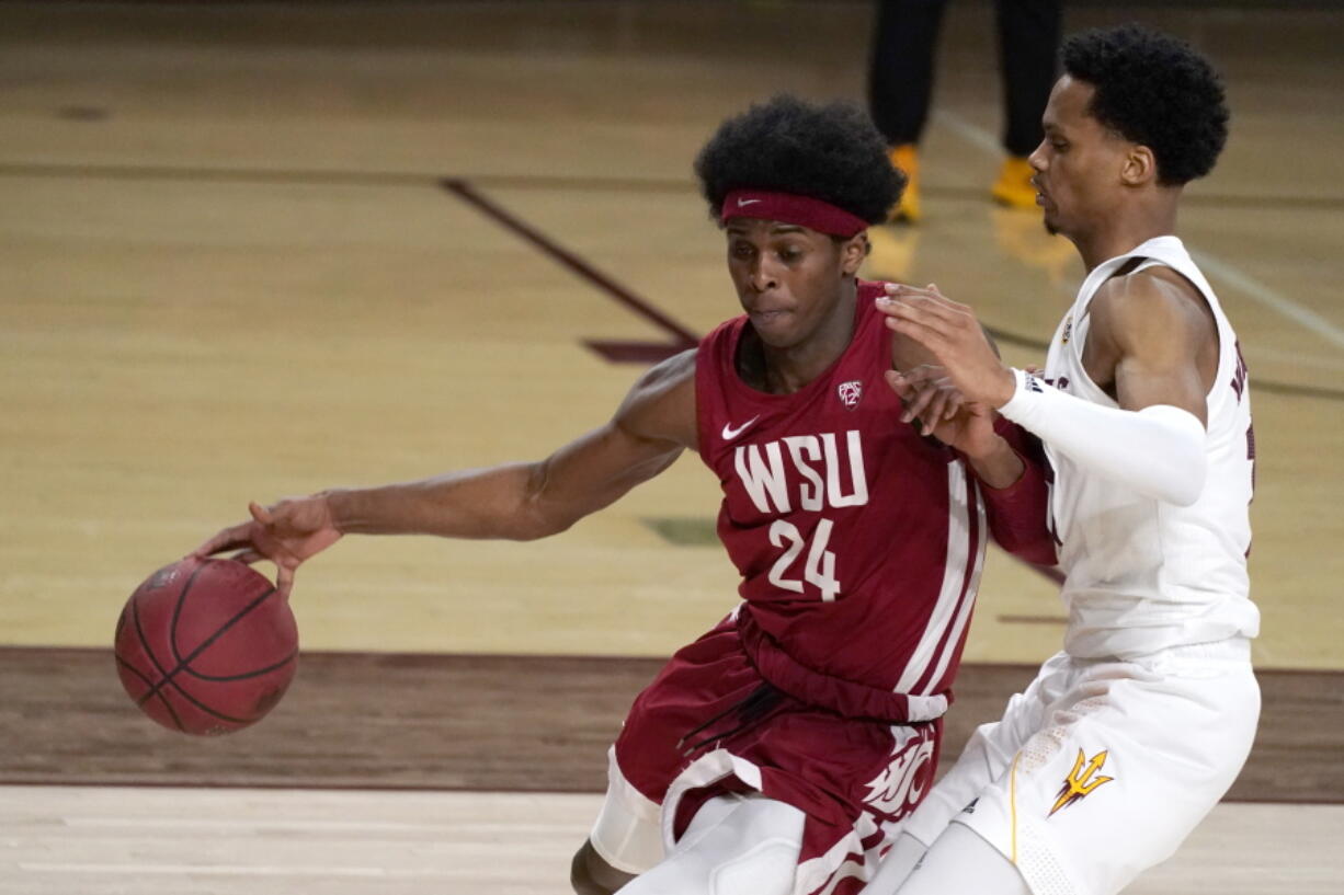 Washington State guard Noah Williams (24) drives past Arizona State guard Alonzo Verge Jr. during the second half of an NCAA college basketball game Saturday, Feb. 27, 2021, in Tempe, Ariz.