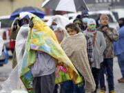 People wait in line to fill propane tanks Wednesday, Feb. 17, 2021, in Houston. Customers waited over an hour in the freezing rain to fill their tanks. Millions in Texas still had no power after a historic snowfall and single-digit temperatures created a surge of demand for electricity to warm up homes unaccustomed to such extreme lows, buckling the state&#039;s power grid and causing widespread blackouts. (AP Photo/David J.