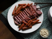 Baked corned beef with caramelized onions and carrots, prepared by Shannon Kinsella.