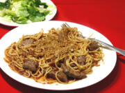 Crispy spaghetti with meat strips.