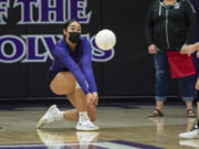 Heritage senior Katie Peneueta (left) makes a play on the ball during a match against Prairie at Heritage High School on Feb.