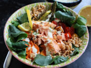 A grain bowl with roasted veggies and lemon-garlic salmon is a great way to kick off fish Fridays for Lent.