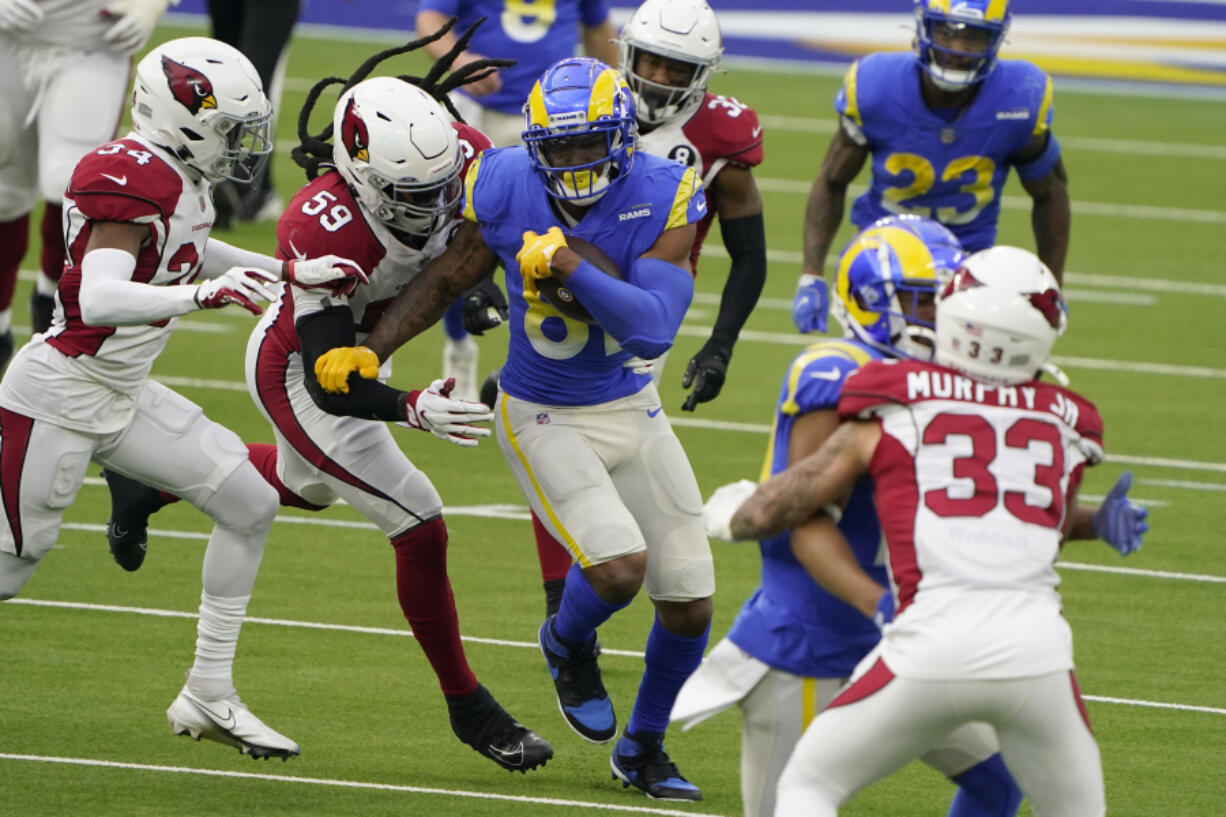 Tight end Gerald Everett, middle, announced on Wednesday, March 17, 2021, that he will sign a one-year deal with the Seattle Seahawks. Everett had a career-high 41 receptions for 417 yards this past season with the Los Angeles Rams. (AP Photo/Jae C.