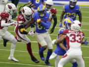 Tight end Gerald Everett, middle, announced on Wednesday, March 17, 2021, that he will sign a one-year deal with the Seattle Seahawks. Everett had a career-high 41 receptions for 417 yards this past season with the Los Angeles Rams. (AP Photo/Jae C.