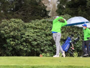 Graham Moody of Mountain View tees off at the par-3 fourth hole at Club Green Meadows on Thursday. Moody won his third 3A boys golf district title.