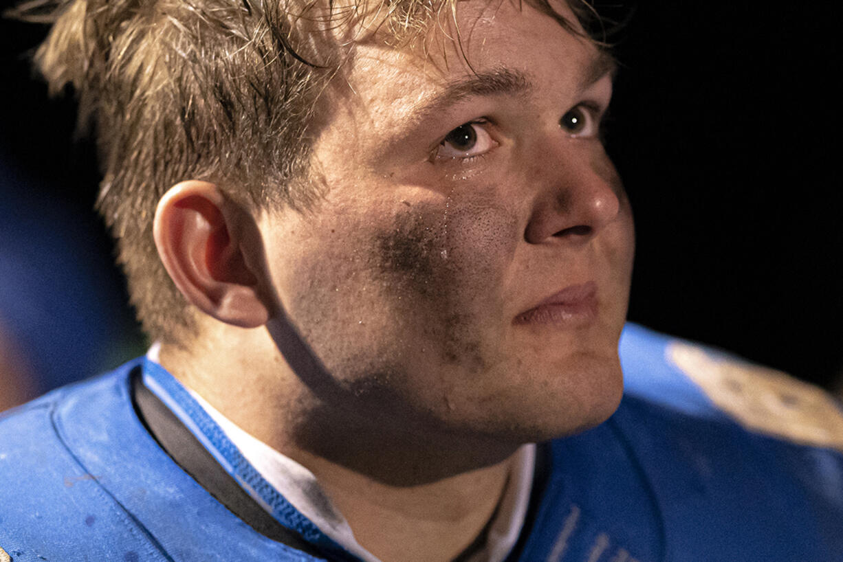 La Center’s Tom Lambert cries following the Wildcat’s win over Castle Rock at La Center High School on Friday night, March 19, 2021 (Nathan Howard for The Columbian)