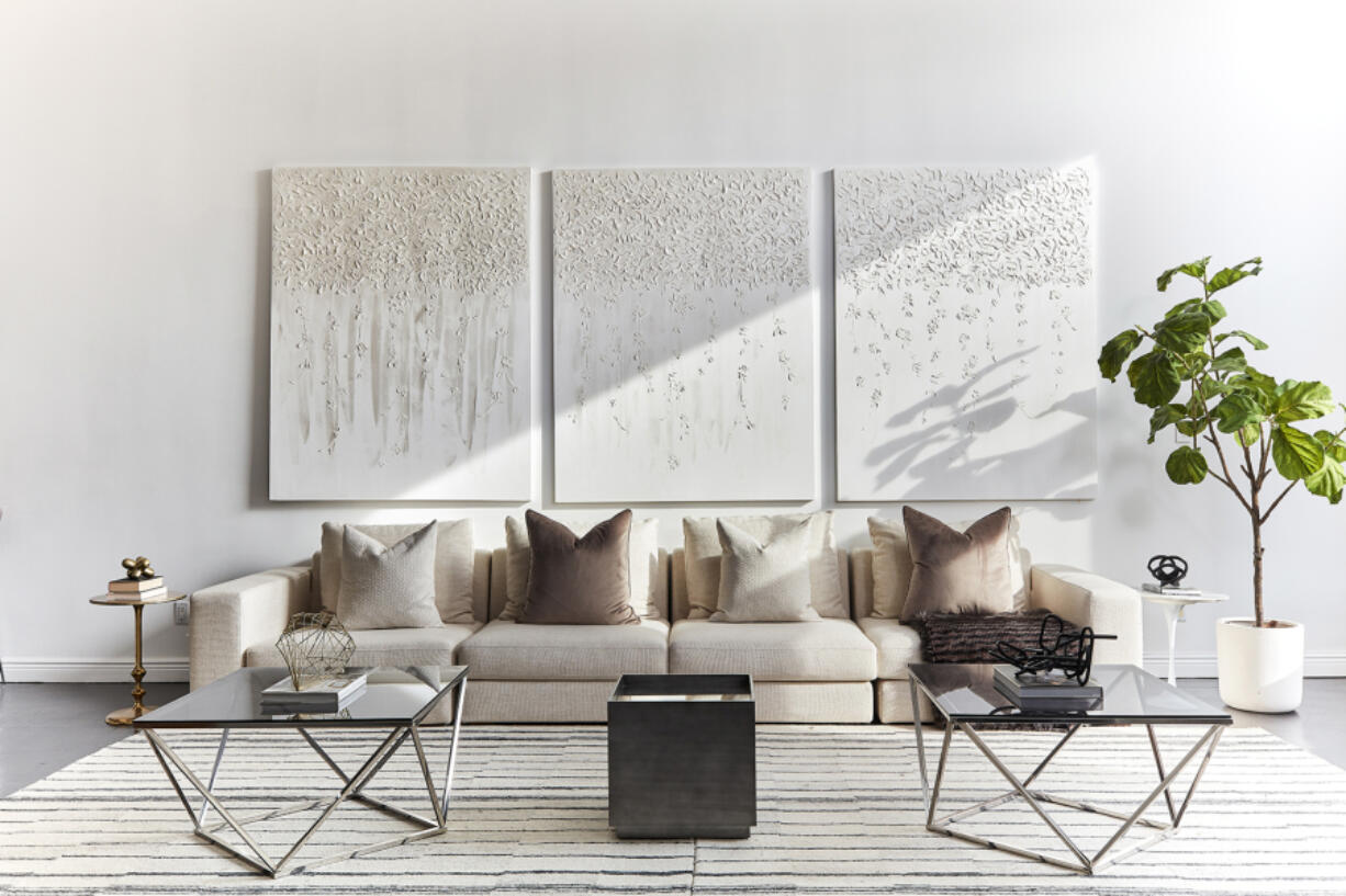 Artwork featuring purely white on white steals the show in this modern living space.