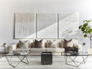 Artwork featuring purely white on white steals the show in this modern living space.