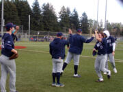 King's Way Christian players come off the field at the end of an inning during a game against Seton Catholic at Harmony Sports Complex on March 22, 2021 (Tim Martinez/The Columbian)