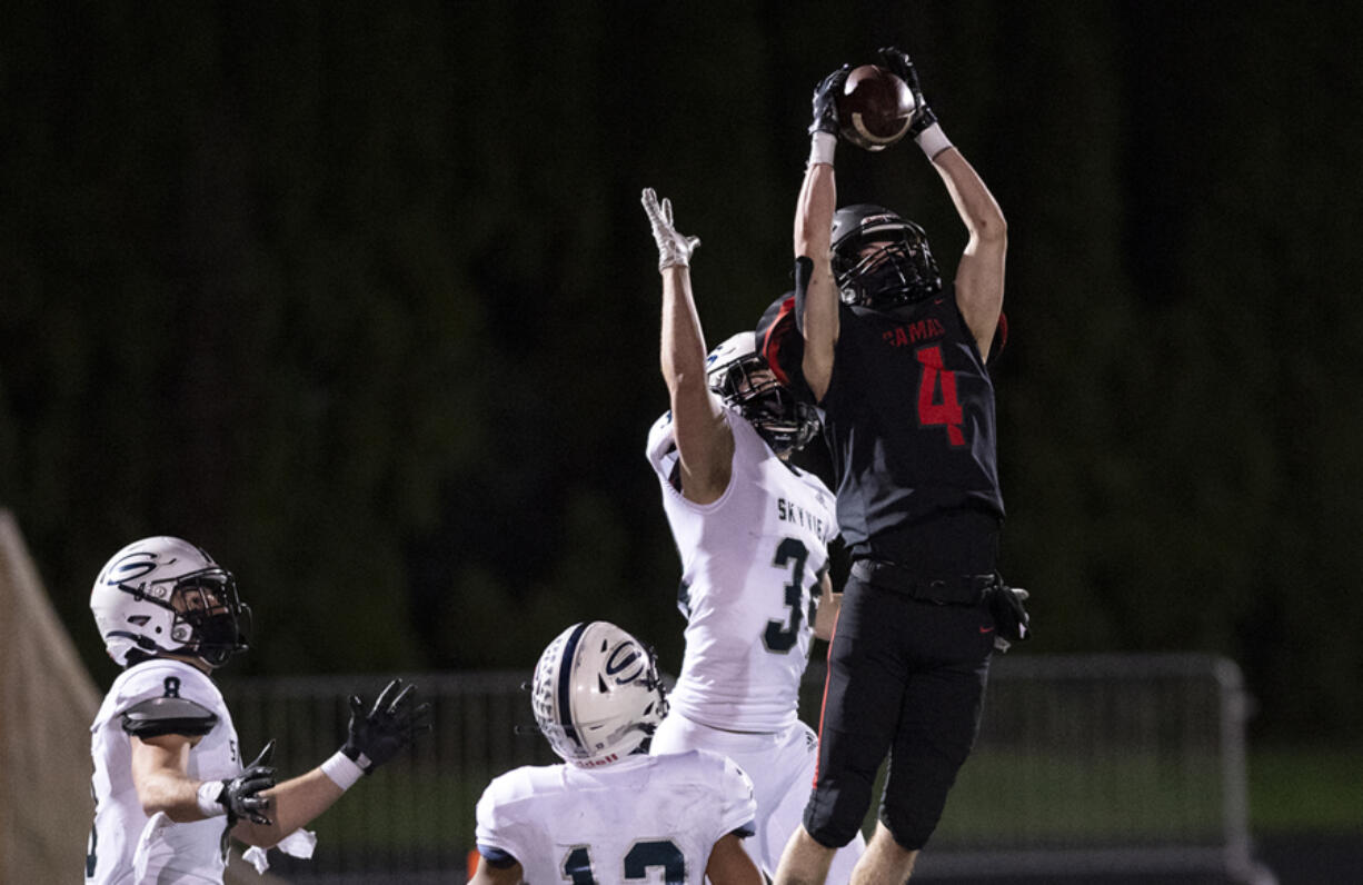 Camas's Andrew Caroussos outleaps Skyview's Brenner Tobiasson for a 35-yard fourth-down completion in the fourth quarter of the Papermakers' 38-31 victory on last season at Doc Harris Stadium. The catch set up Camas&#039; game-tying field goal when time expired.