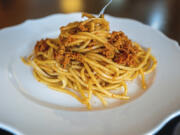 Spaghetti served with piquant sun-dried tomatoes and pistachio pesto.