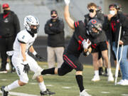 Skyview&#039;s Jaydin Knapp pushes Camas&#039; Gabe Guo out of bounds during the Papermakers&#039; 38-31 double-overtime win over the Storm on Tuesday night.