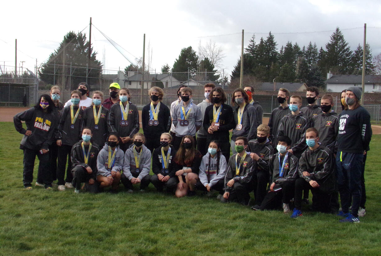 The Prairie boys and girls cross country teams pose for a team photo after both teams swept to team titles at the 3A Greater St. Helens League meet on Thursday, March 25, 2021.